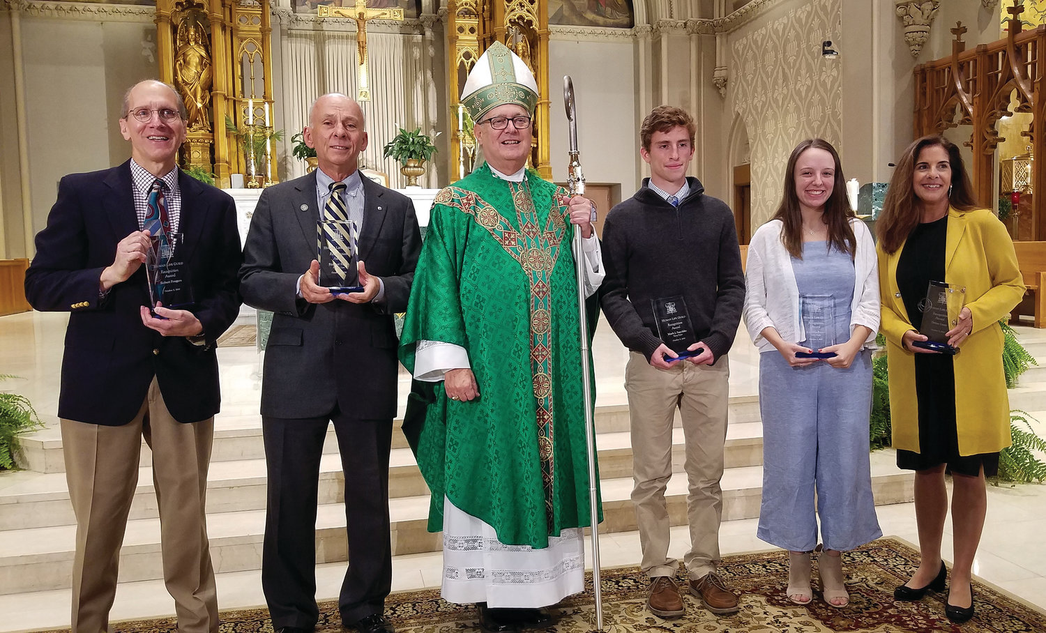 Bishop Thomas J. Tobin with award recipients after Mass. From left,  Robert Fougere, Richard Forest, Bishop, Mark Sapolsky, Cordelia Ruzzo and Debra Carey.